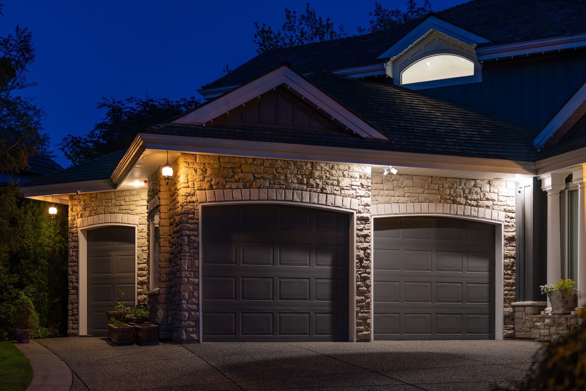 A house with their garage doors closed and secure. 