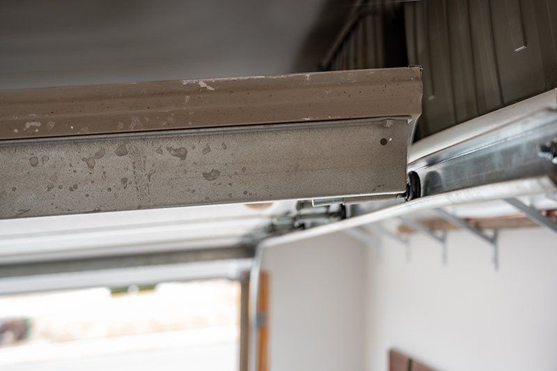 Garage door track repairs and maintenance.