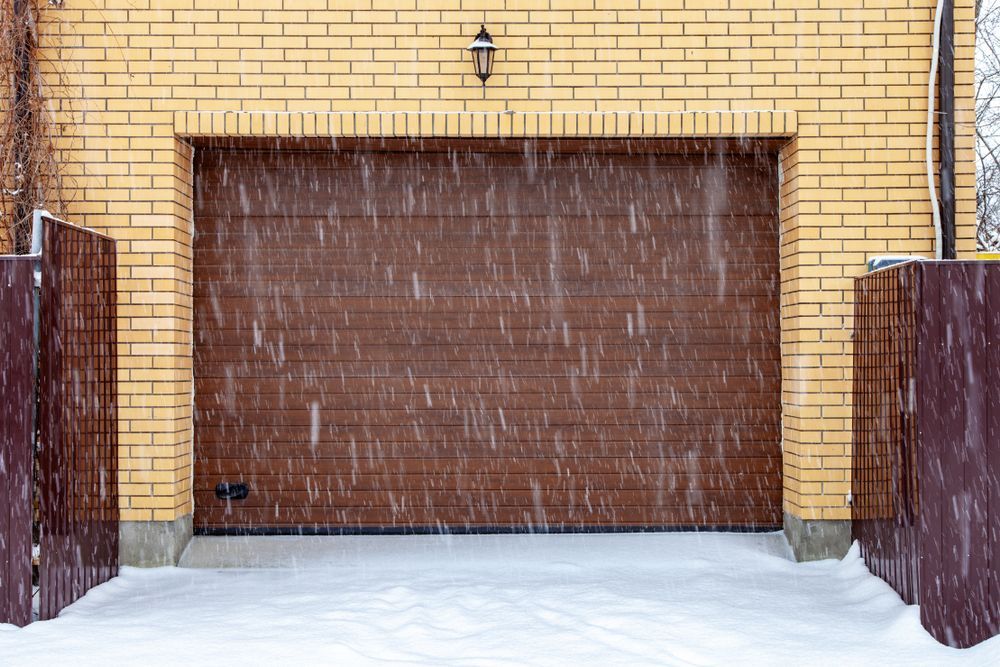 A home with a brown frozen shut garage door.