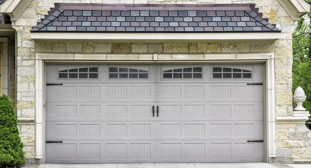 A house with a closed garage door.
