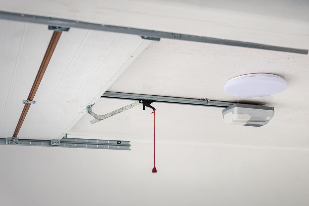 A close up of a garage door opener in a garage.