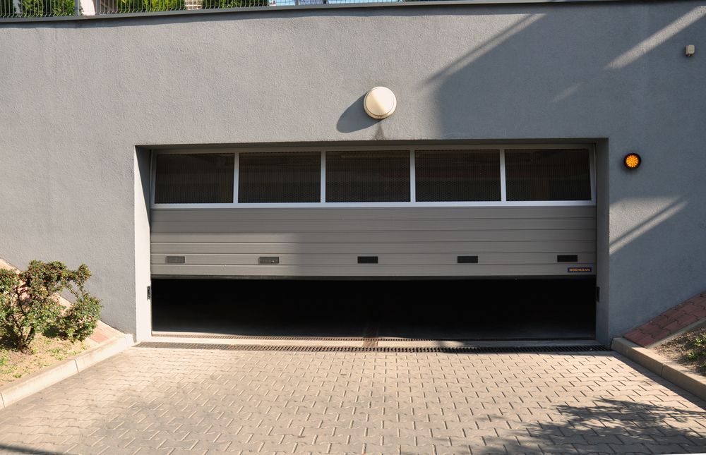 A garage door that is stuck halfway.