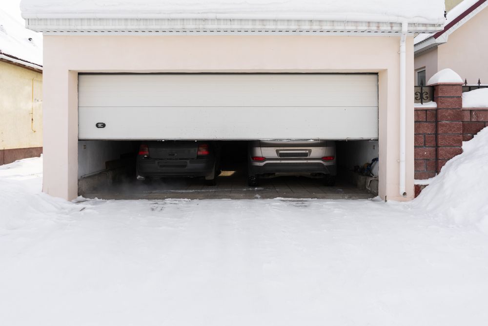 A garage door that won't close due to the cold weather.