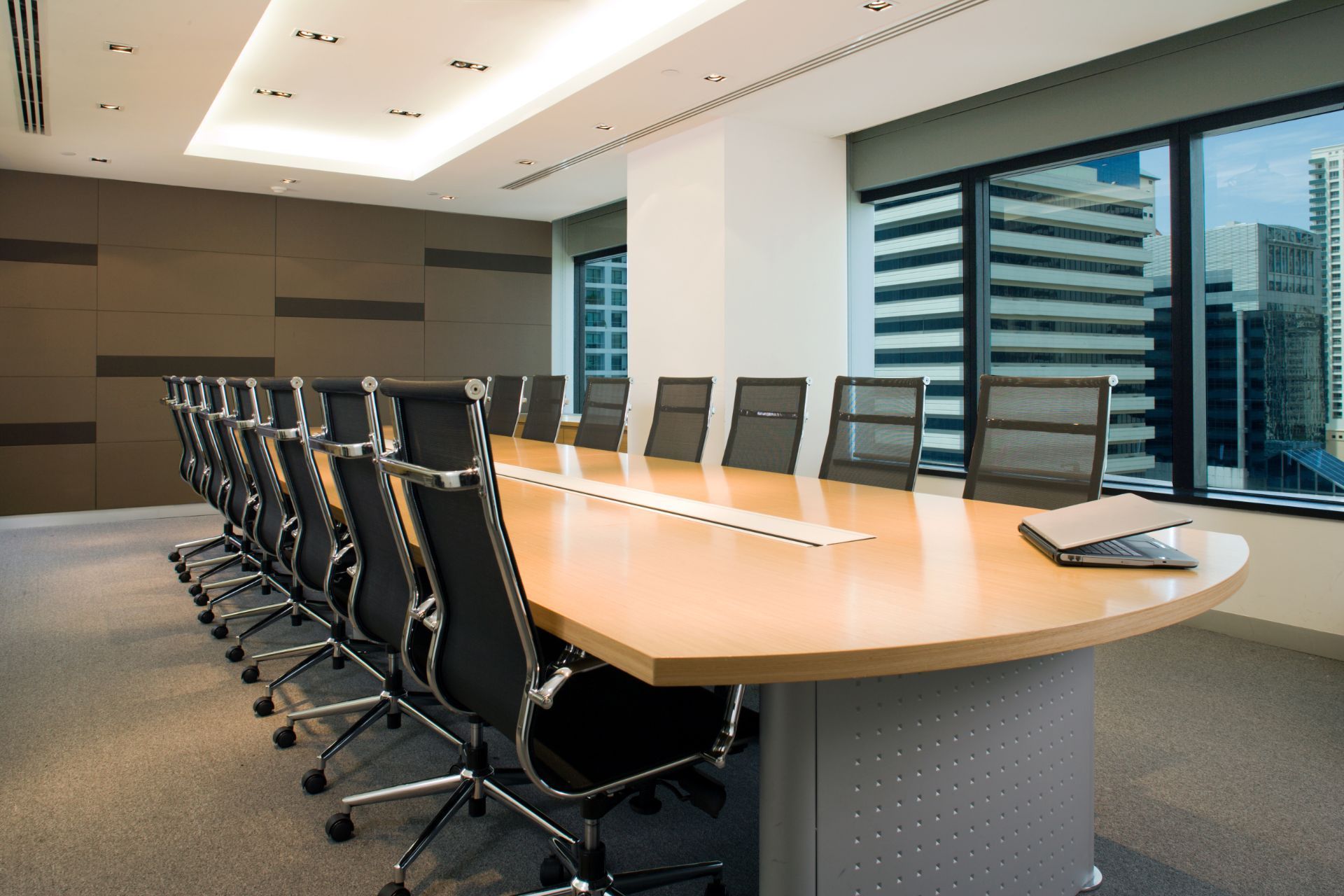 A conference room with a long table and chairs