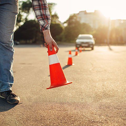 Instructor Sets The Cone — ABC Driving School in Central Coast NSW