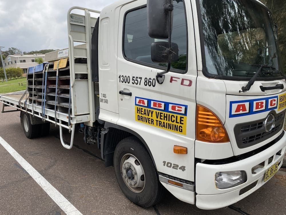 A White Truck Is Parked On The Side Of The Road — ABC Driving School Central Coast In Umina Beach, NSW