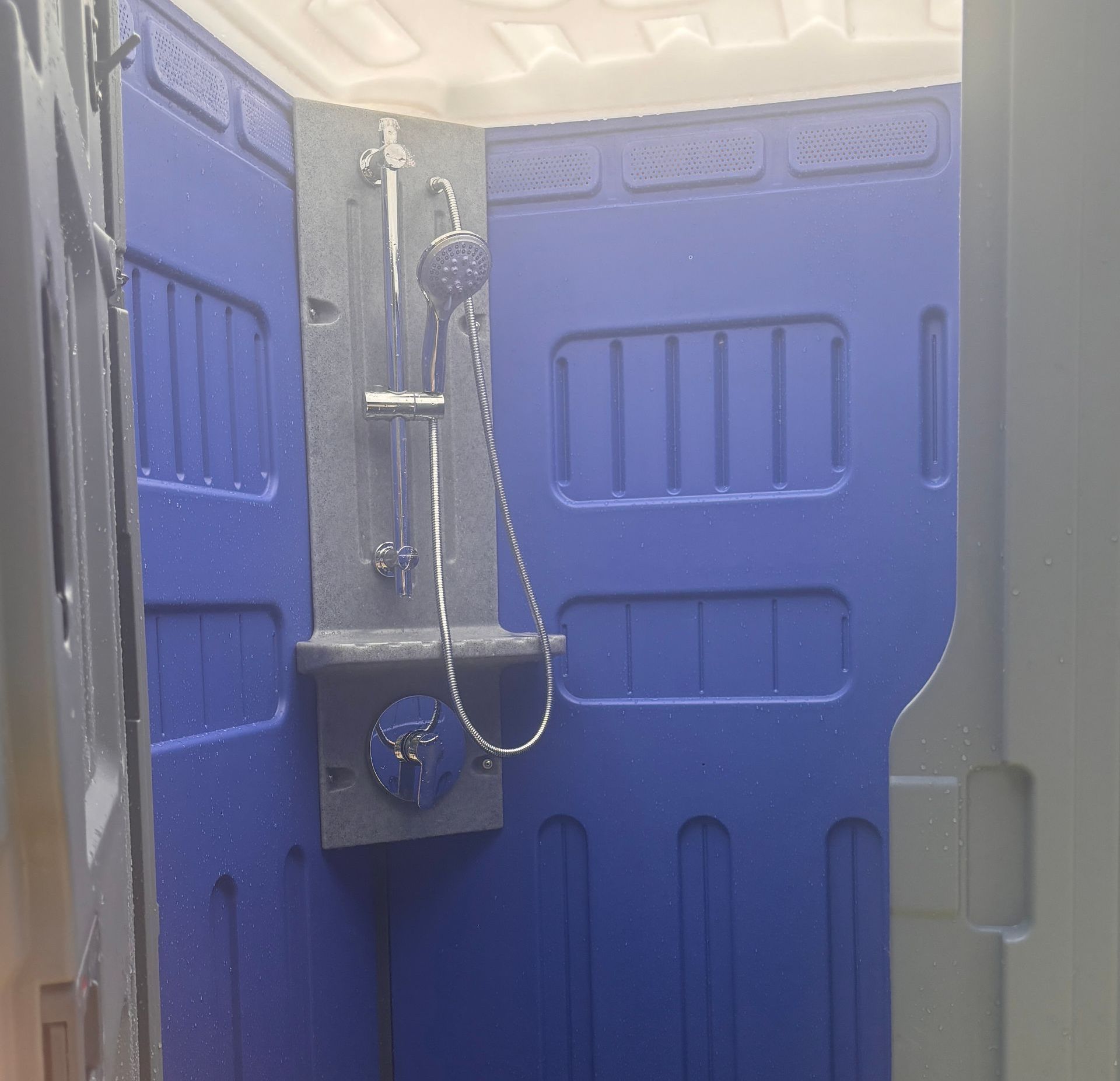 A Row Of Green Portable Toilets Are Lined Up In A Field  — The Portaloo Co in Dimbulah, QLD