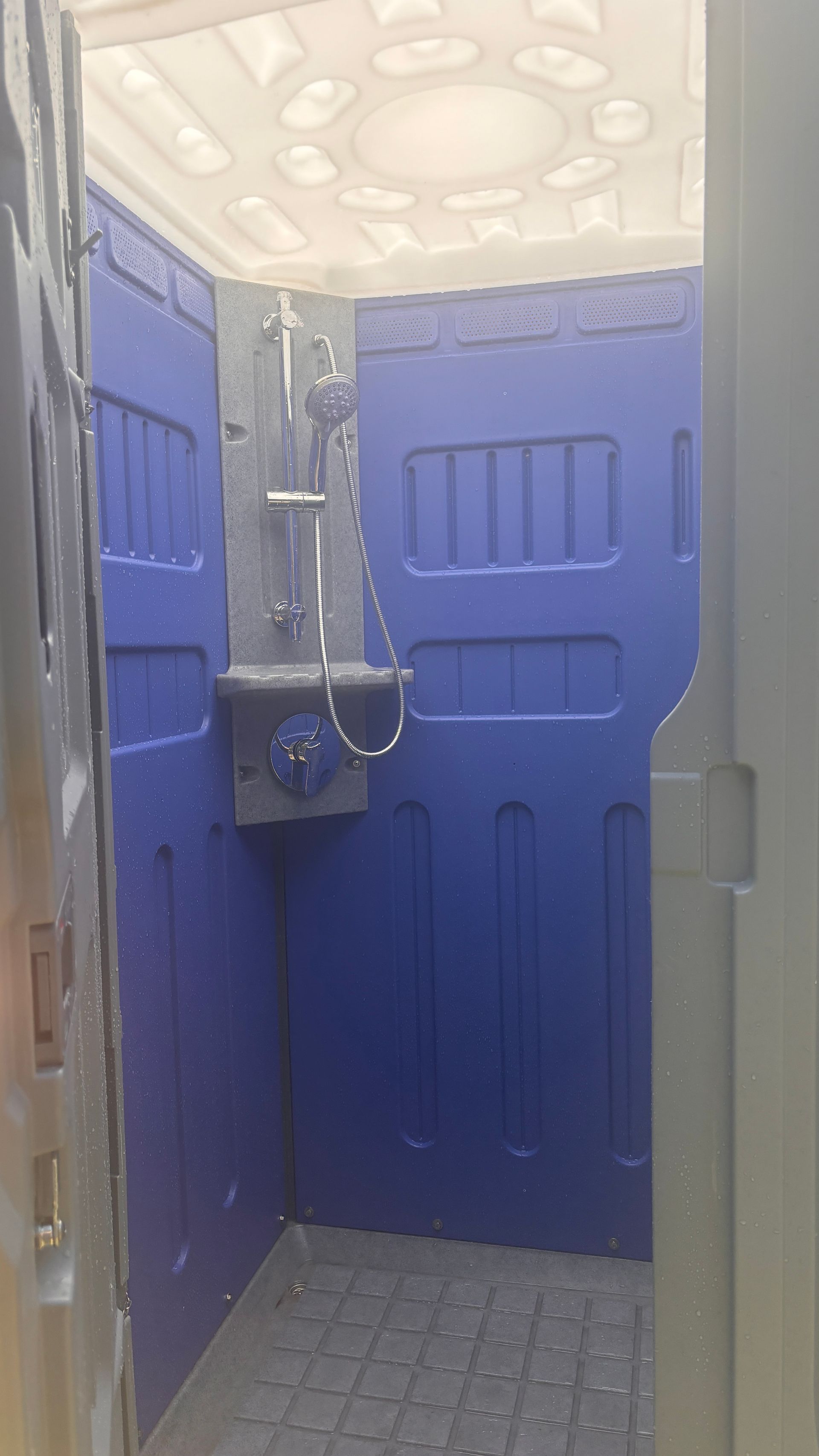 Inside Of A Blue Portable Hot Shower — The Portaloo Co in Atherton, QLD
