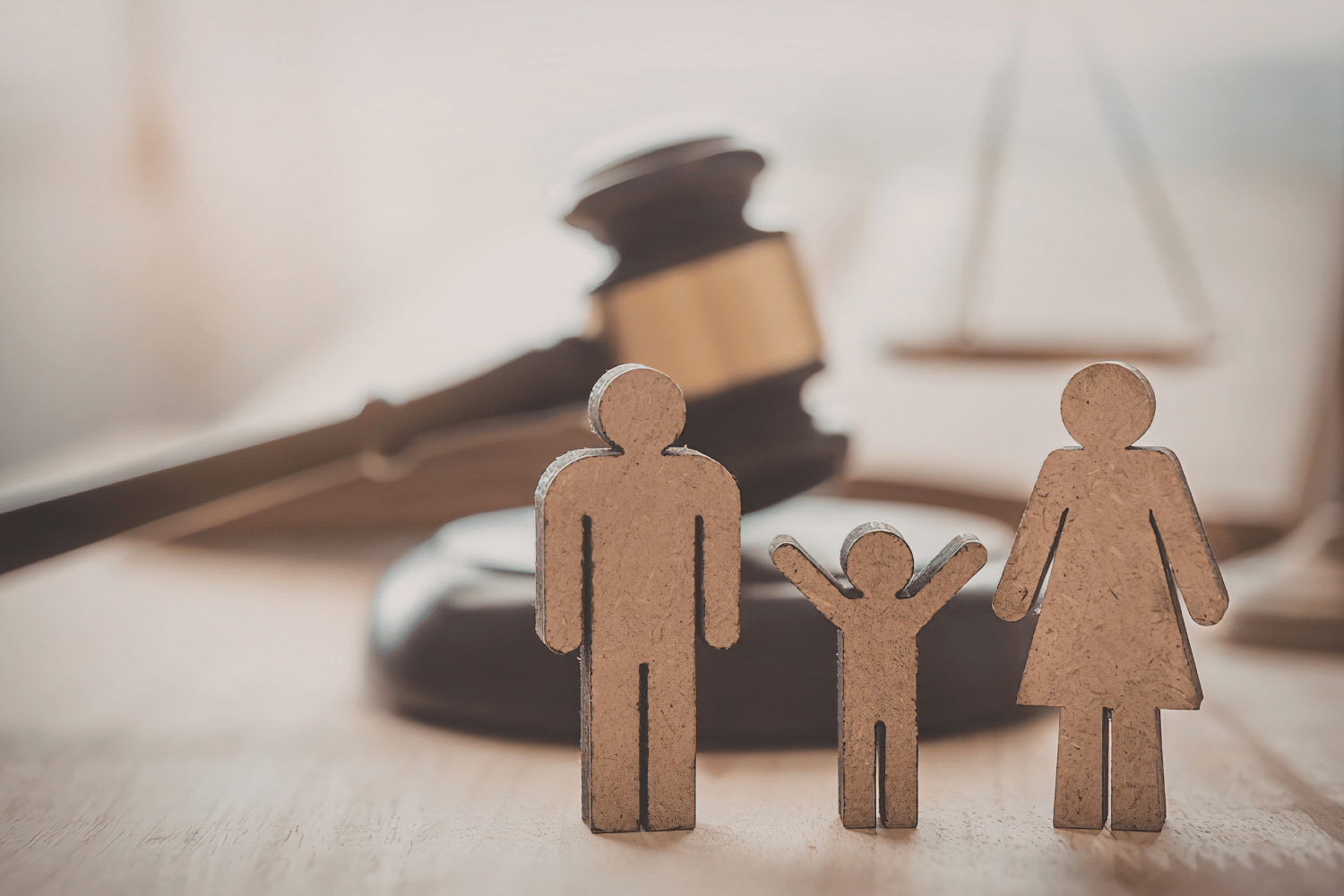 Aerial view of a suburban neighborhood with houses, a road, trees, and a lake.