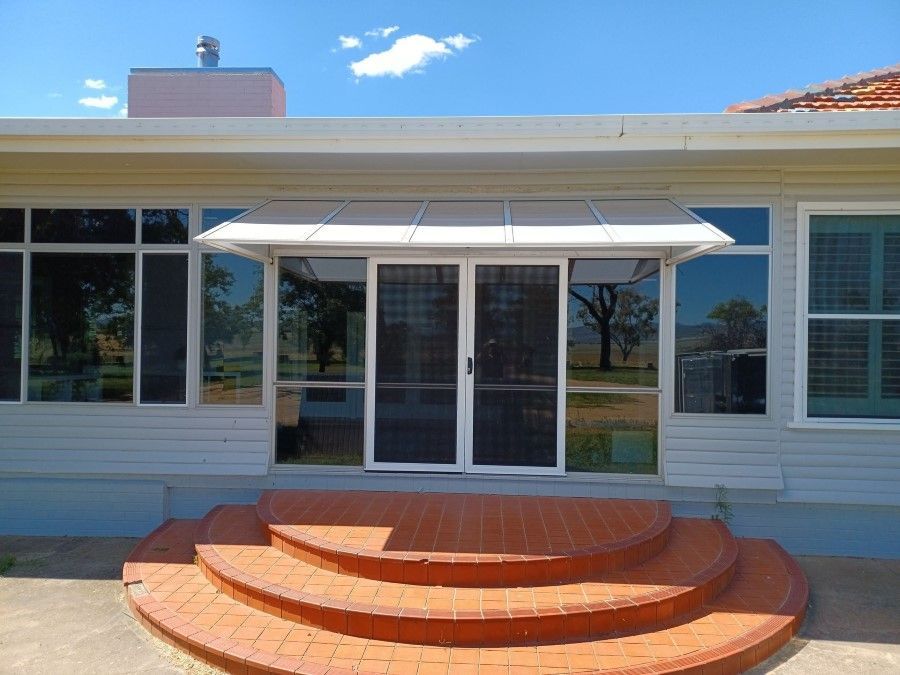 The Front of a House With Stairs Leading Up to It — BTS Blinds & Awnings in Gunnedah, NSW