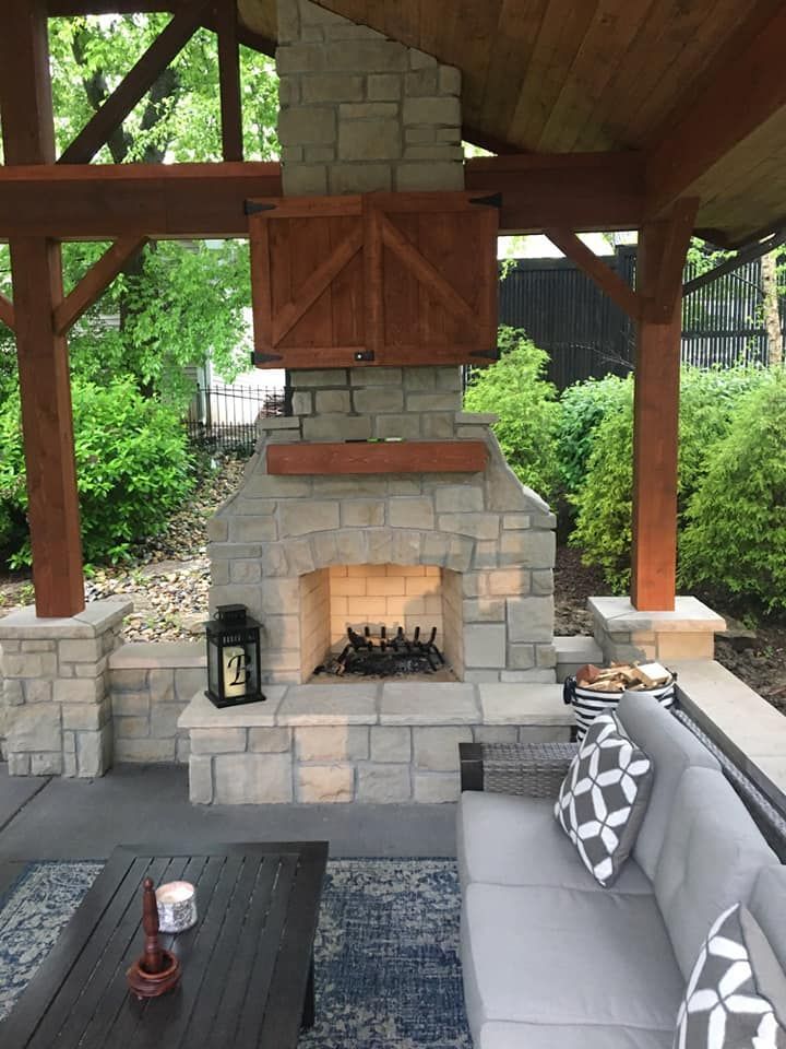 A living room with a fireplace and a couch