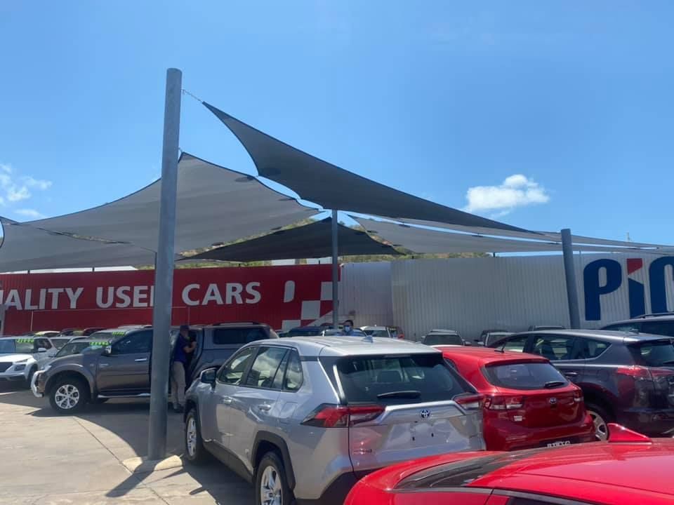 Car Lot Under a Shade Structure — Professional Shade Sail Installation in Maroochydore, QLD