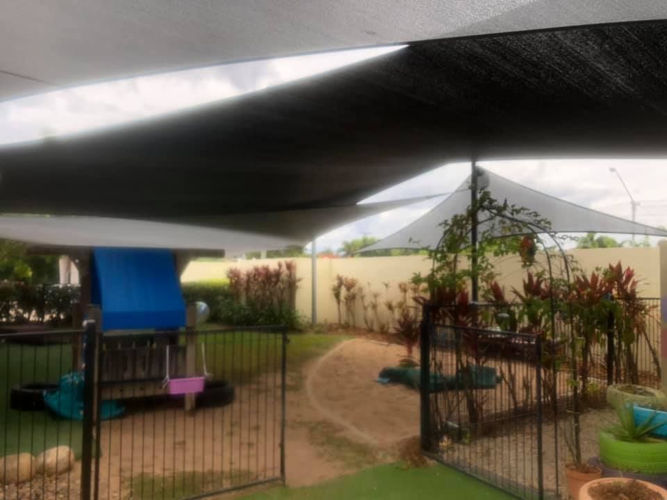 Beautiful Garden Area with a Shade Sail Installed — Professional Shade Sail Installation in Mount Isa, QLD
