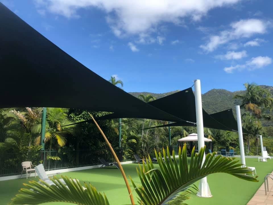 Clean Grass Area with Shade Installed — Professional Shade Sail Installation in Ayr, QLD