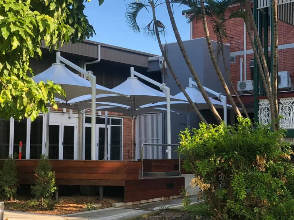 Patio with Umbrellas Installed — Professional Shade Sail Installation in Townsville, QLD