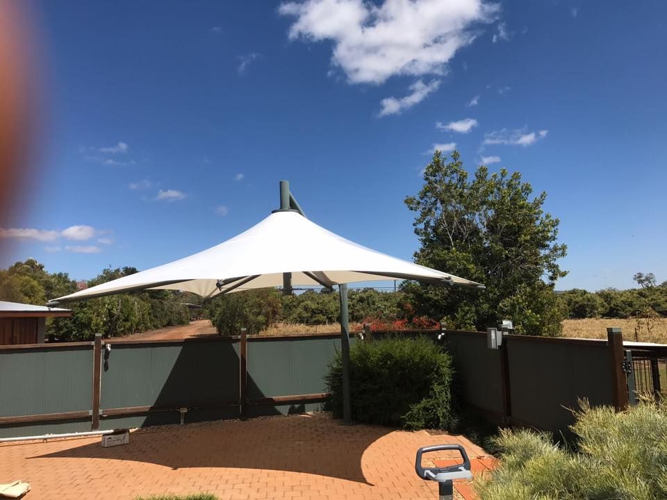 Umbrella Shade on a Fenced Area — Professional Shade Sail Installation in North Queensland, QLD