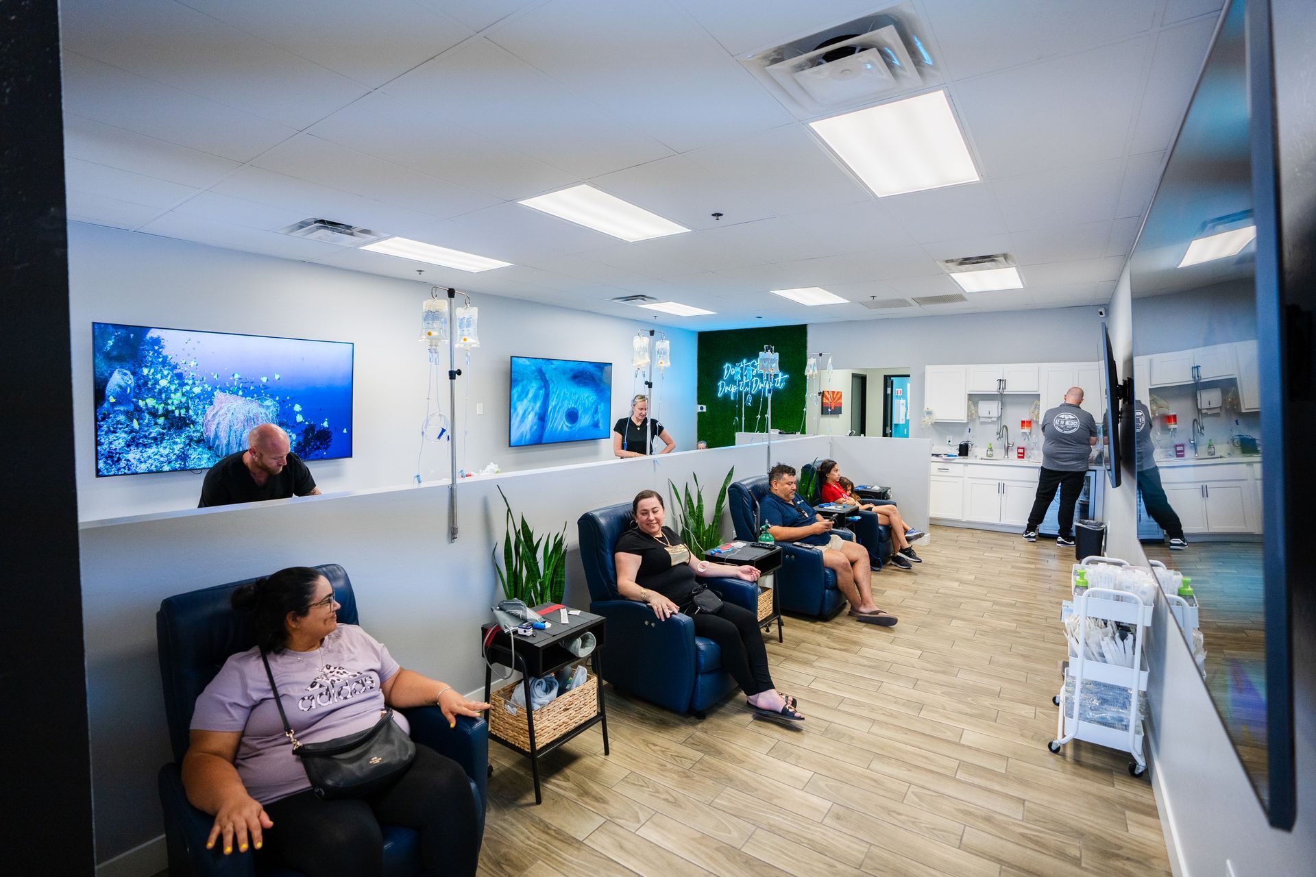 A group of people are sitting in chairs in a room.