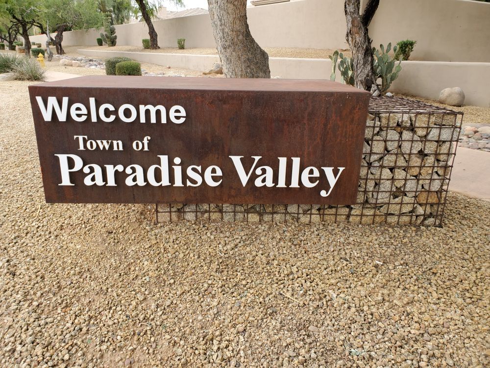 A welcome sign for the town of paradise valley