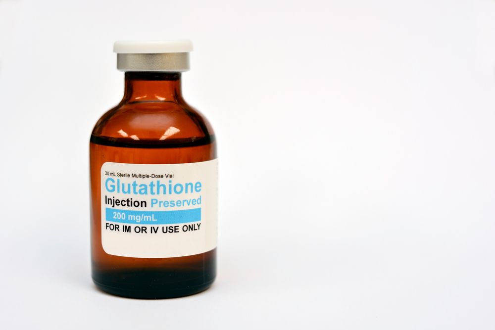 A bottle of glutathione injection on a white background