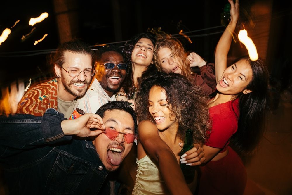 A group of people are posing for a picture at a party.