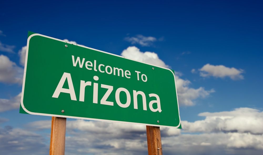 A green sign that says welcome to arizona