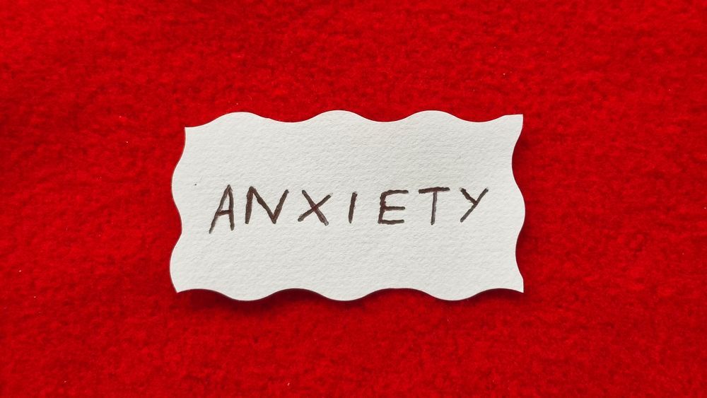 A piece of paper with the word anxiety written on it