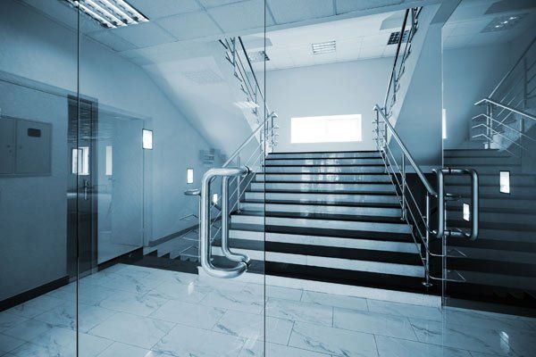 Glass doors with a marble staircase