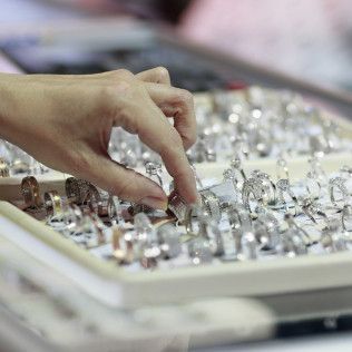 A close up of a pile of jewelry on a table.