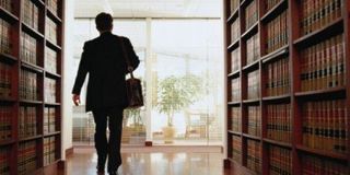 Lawyer Exiting a Law Library - Attorney at Law in New Castle, PA