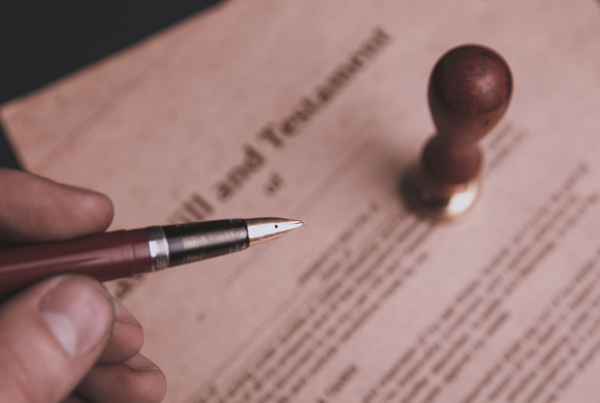 Close-up of a hand holding a pen. 