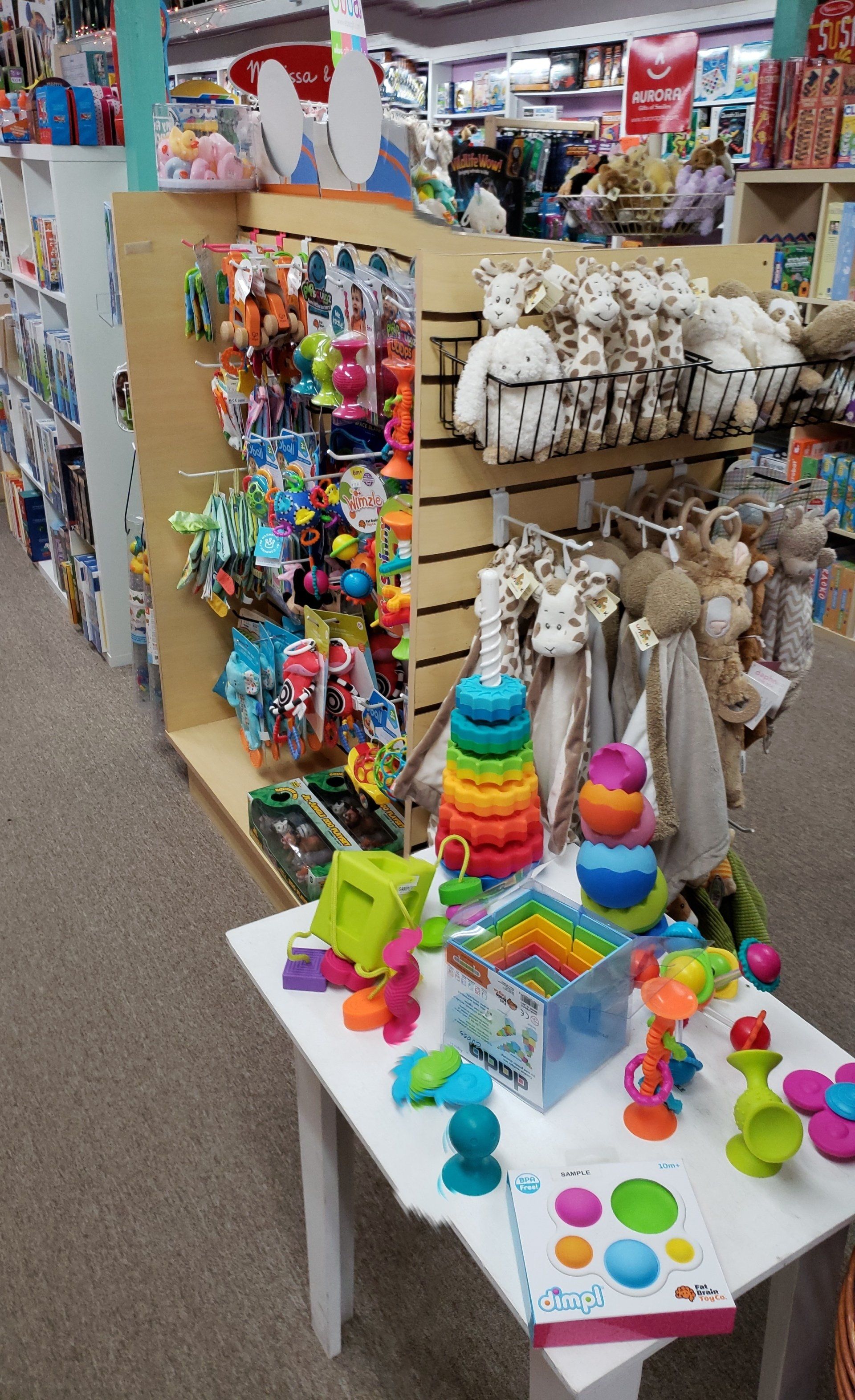 A table with toys on it in a toy store.