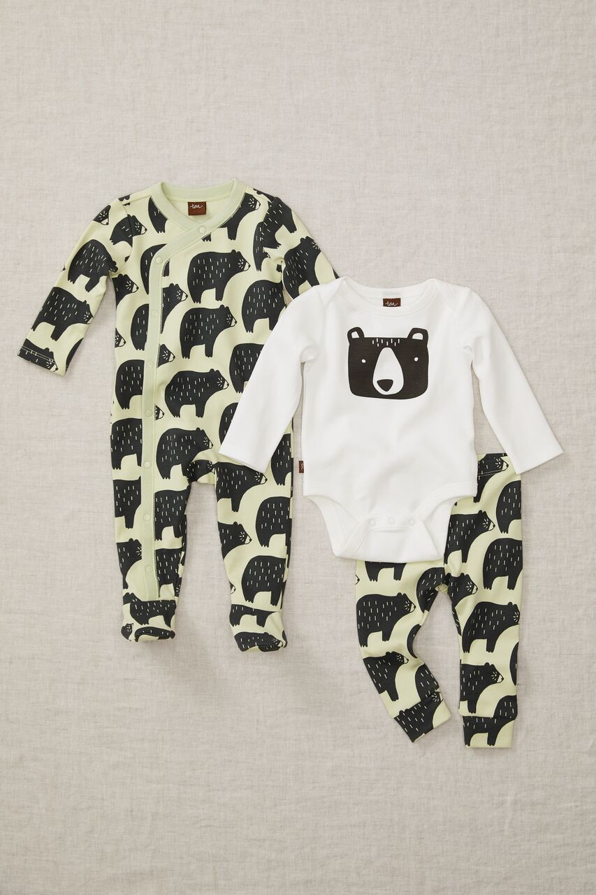 A baby 's outfit with a bear on it