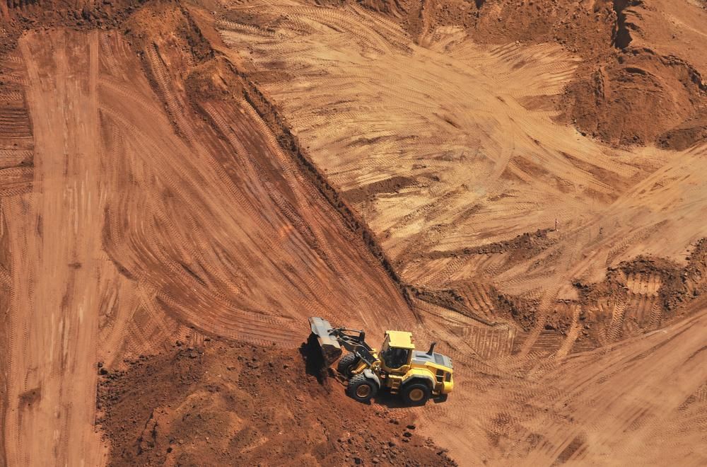 An Aerial View of a Bulldozer in a Dirt Field — Chooks Sand And Gravel In Bowen, QLD