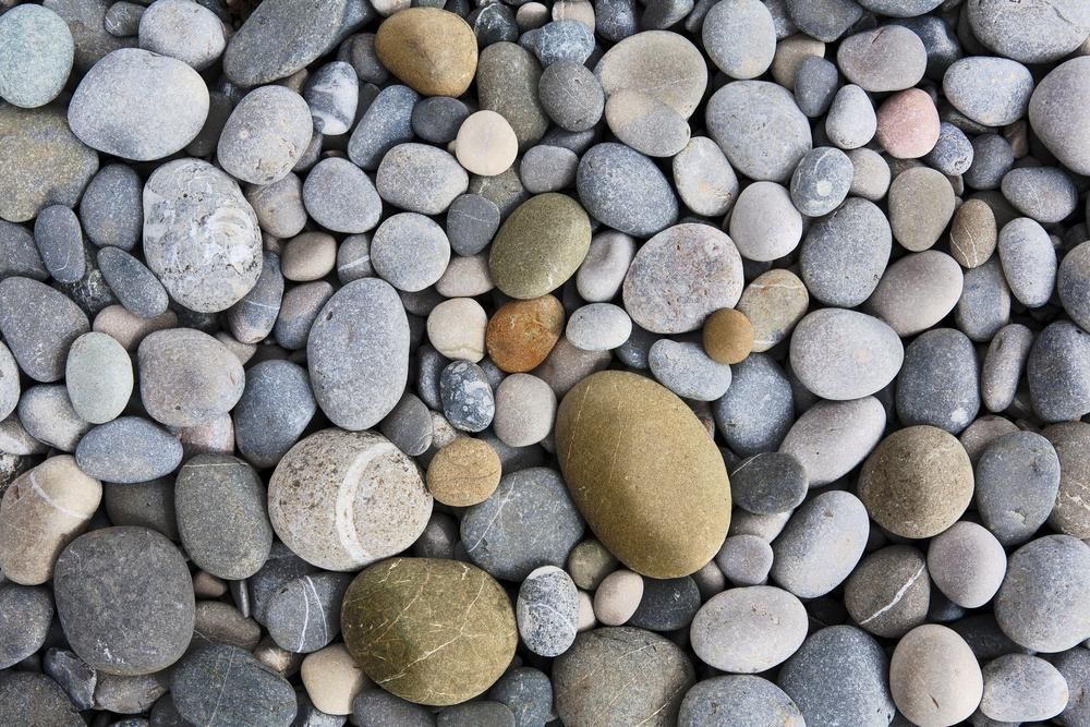 A Pile of Rocks With a Yellow Rock in the Middle — Chooks Sand And Gravel In Paget, QLD