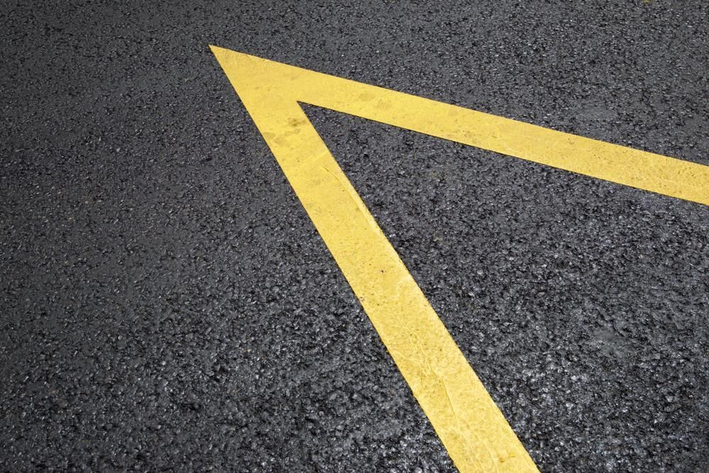 A Close Up of a Yellow Line on the Road — Chooks Sand And Gravel In Proserpine, QLD