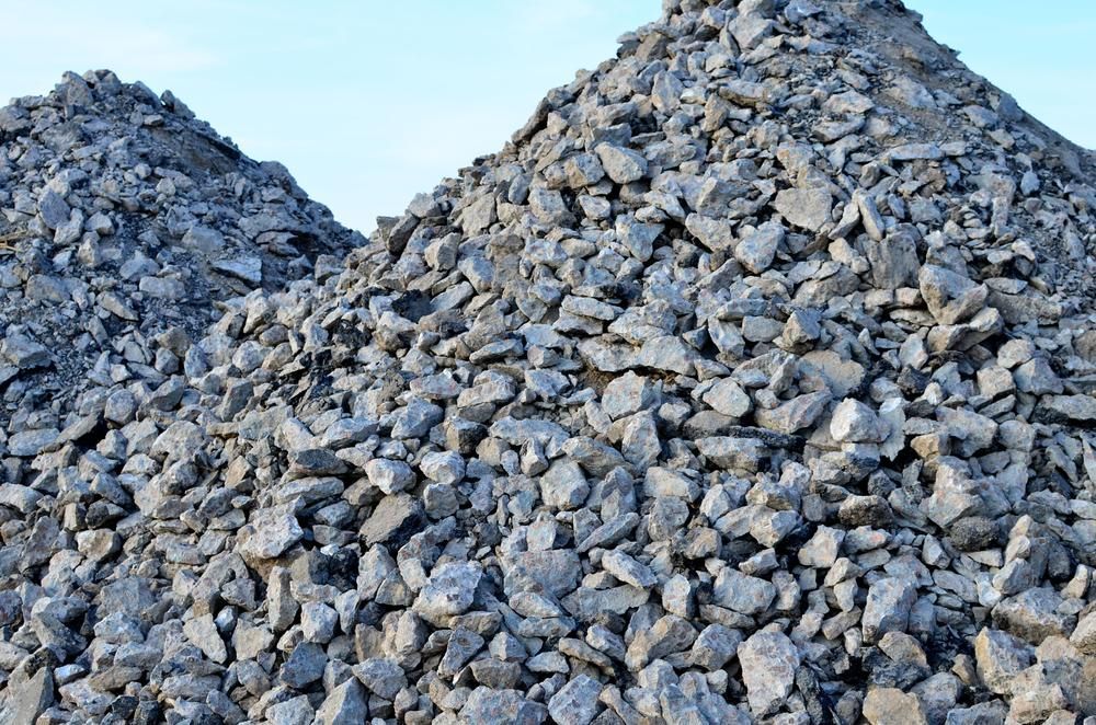 Two Piles of Rocks Are Stacked on Top of Each Other — Chooks Sand And Gravel In Paget, QLD