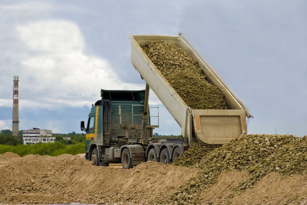 A Large Dump Truck Unloads a Pile of Rocks — Chooks Sand And Gravel In Moranbah, QLD