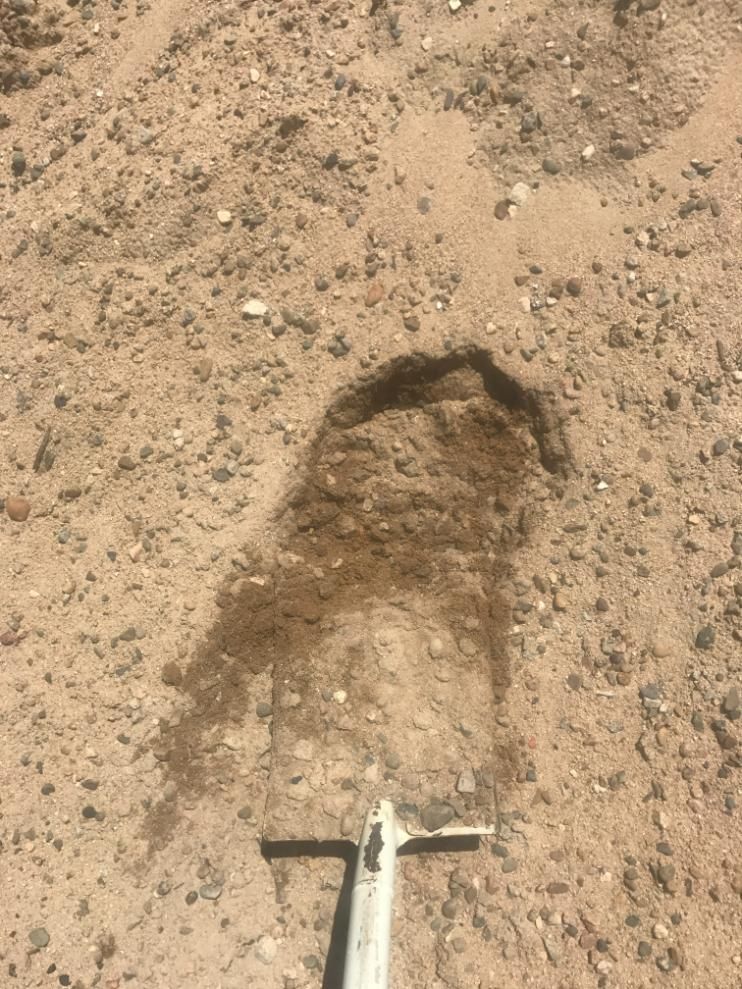 There is a Footprint in the Dirt Next to a Shovel — Chooks Sand And Gravel In Paget, QLD