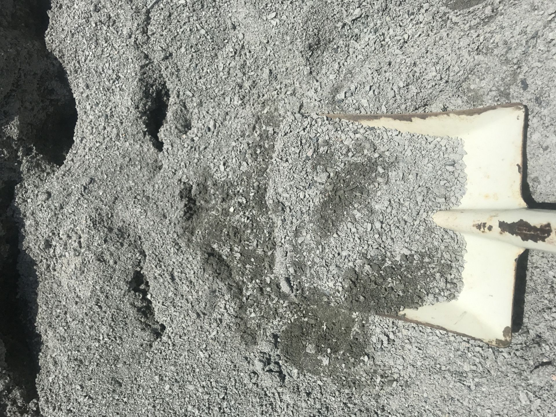 Gray Concrete Mix With a White Shovel Partially Submerged — Chooks Sand And Gravel In Paget, QLD