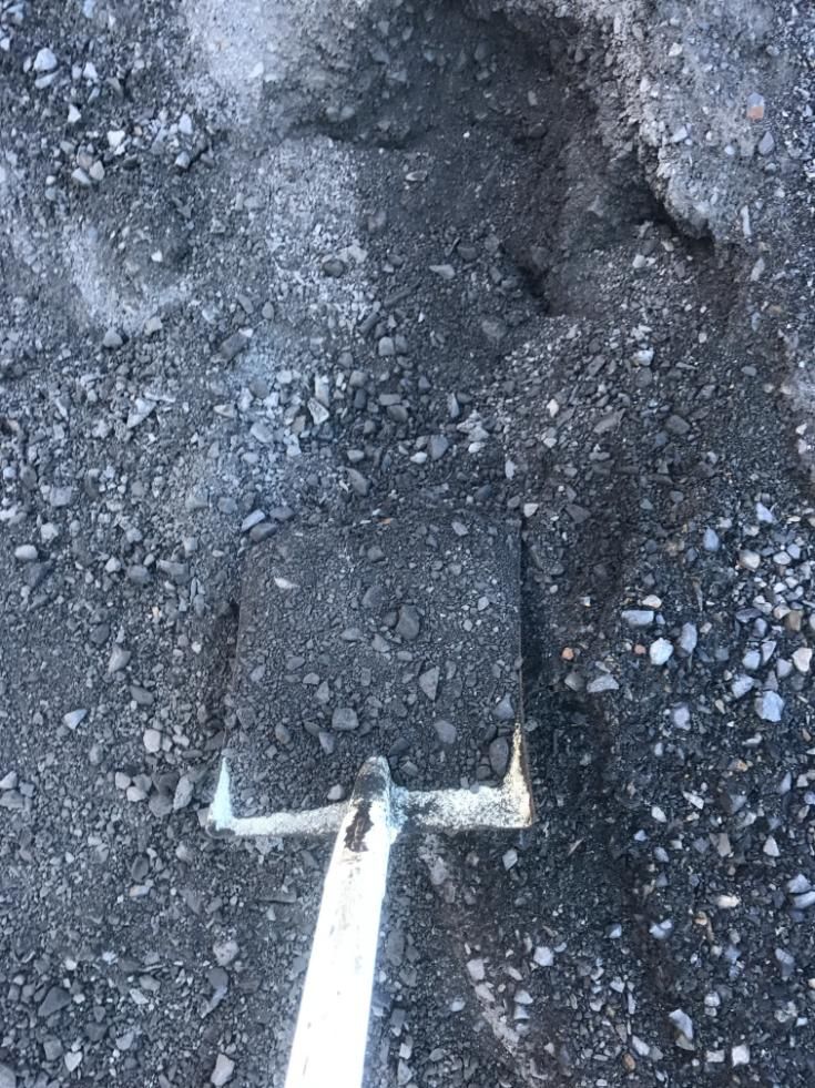 A Shovel is Sitting on Top of a Pile of Dirt — Chooks Sand And Gravel In Paget, QLD