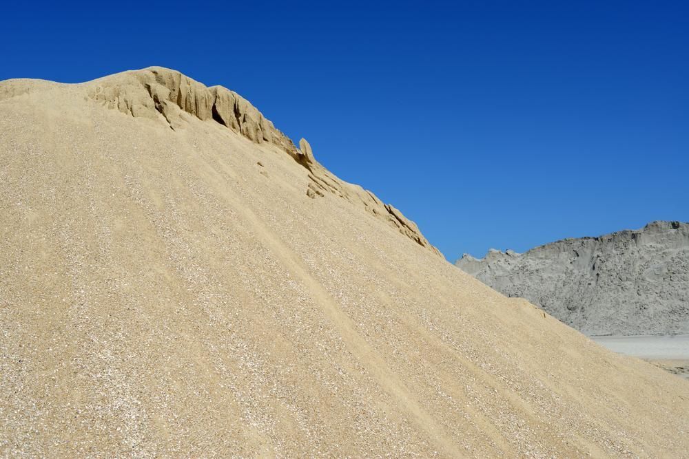 A Large Pile of Sand Against a Blue Sky — Chooks Sand And Gravel In Paget, QLD