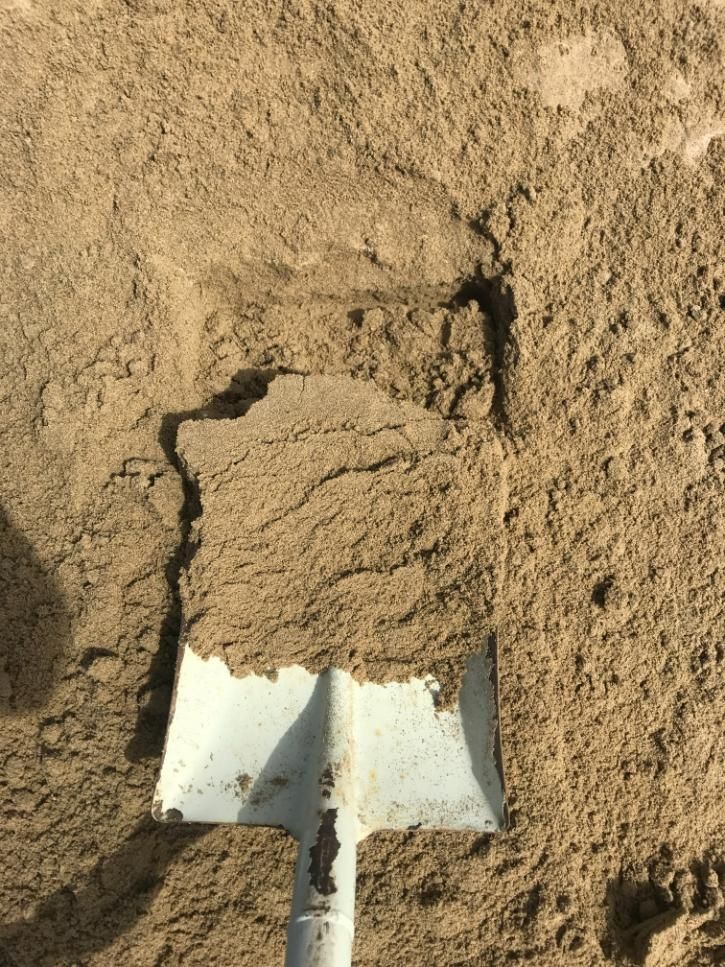A Shovel is on Top of a Pile of Sand — Chooks Sand And Gravel In Paget, QLD