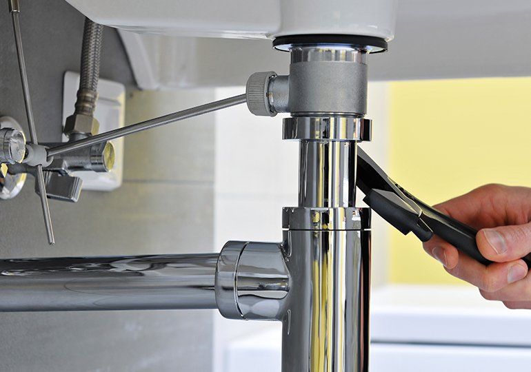 Plumber Repairing The Sink — Sergeant Bluff, IA — Speedy Rooter Plumbing