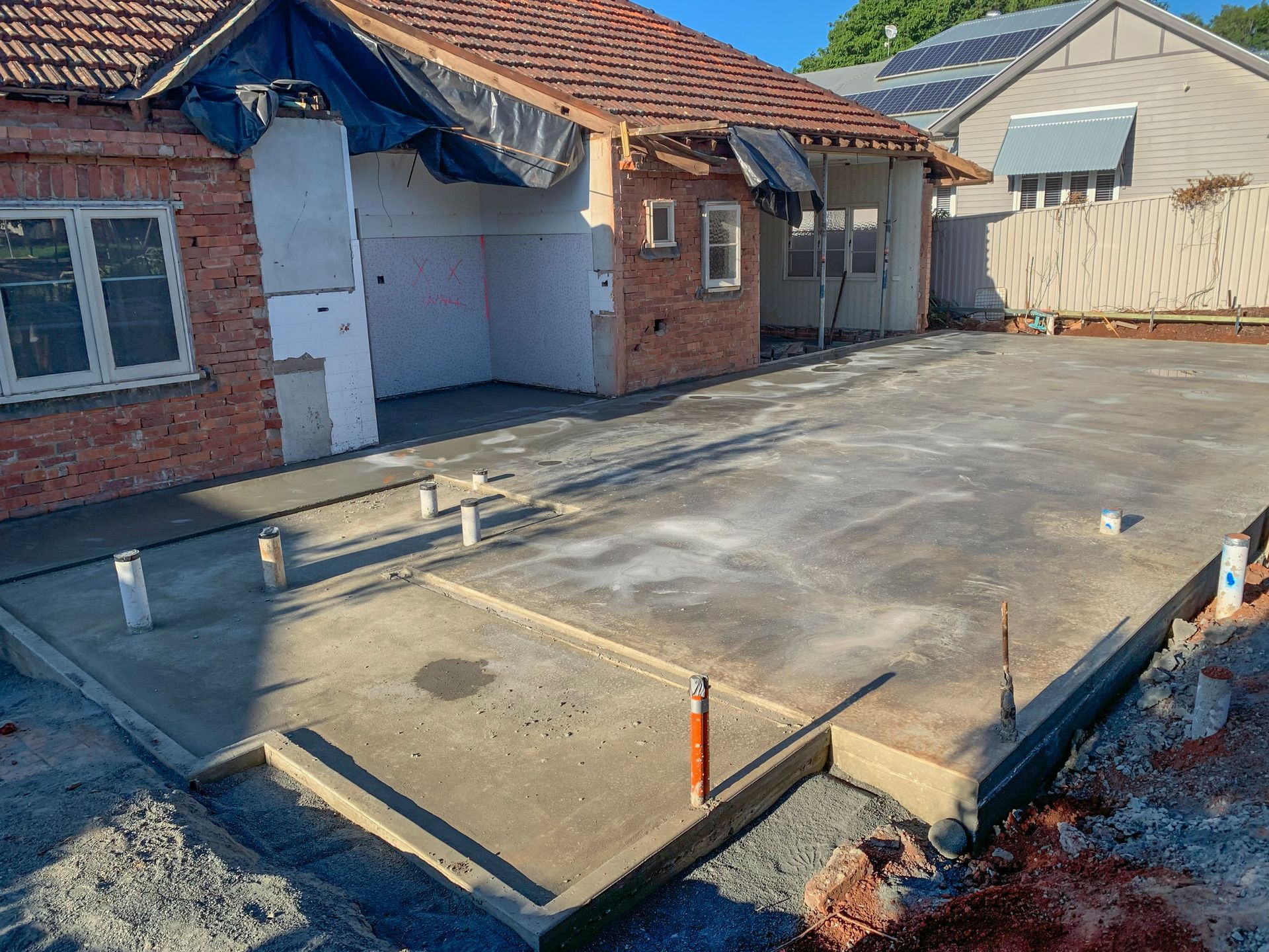 Concrete slab preparation for a house renovation.