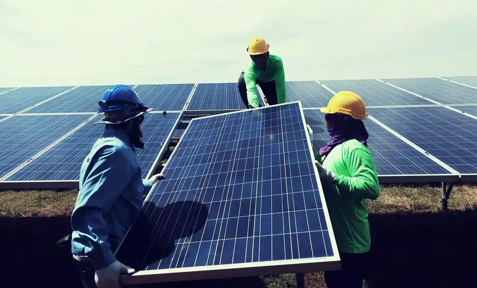 Workers Installing the Solar Panels