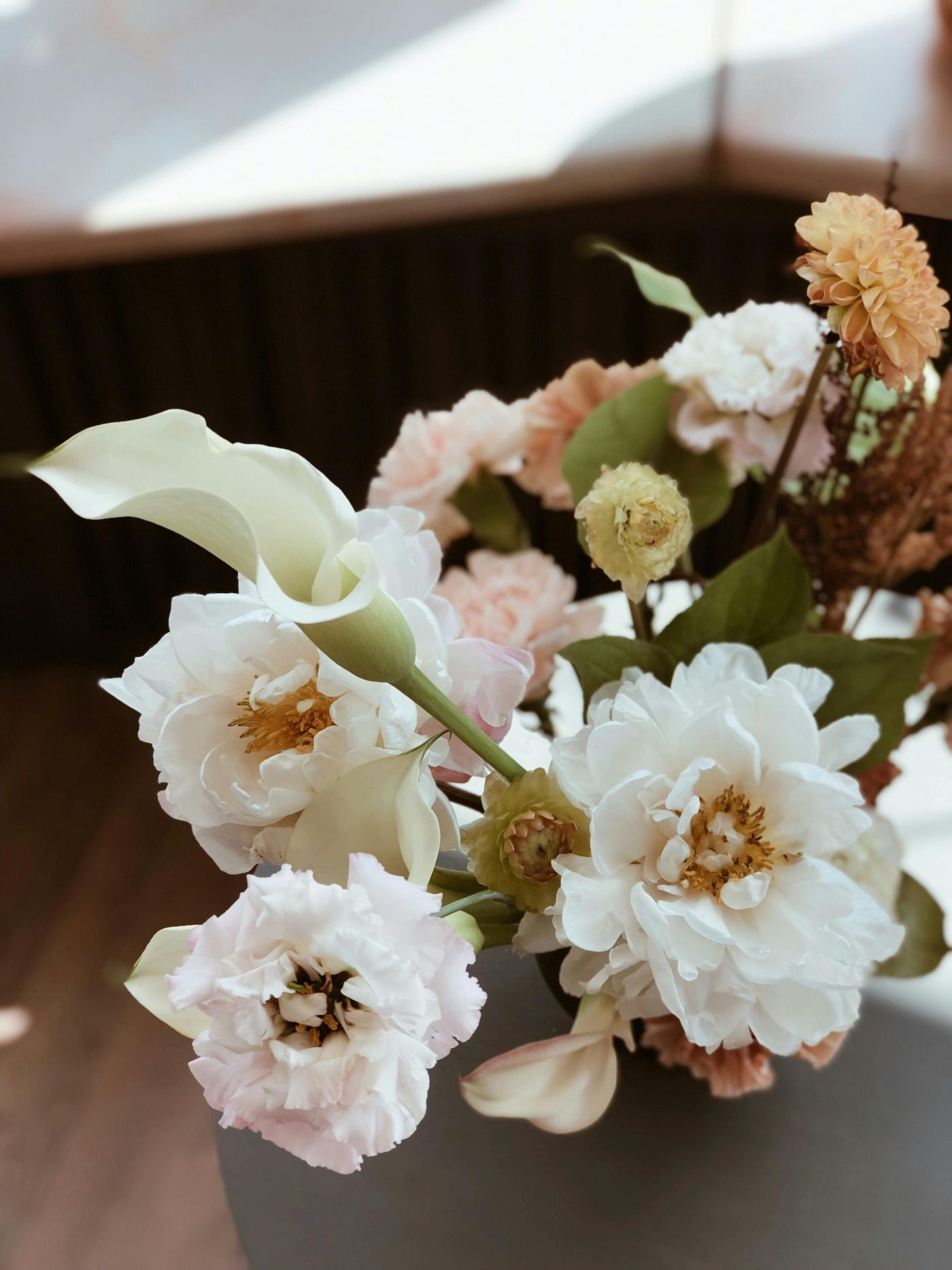 A close up of a bouquet of flowers on a table