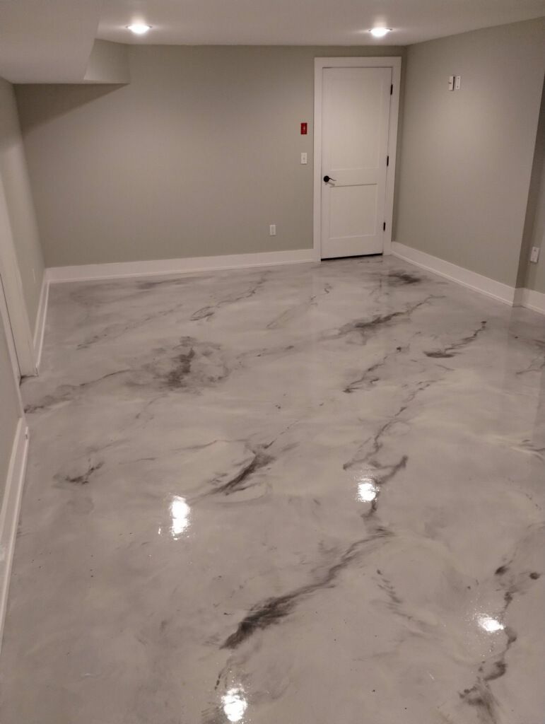 A room with a marble floor and a door.