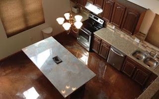 An aerial view of a kitchen with a large island in the middle.