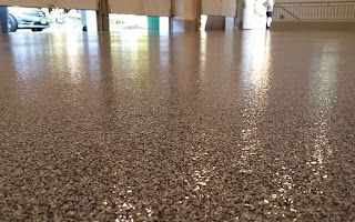 A close up of a shiny concrete floor in a garage.