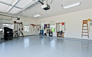 A large garage with a bicycle parked in it.